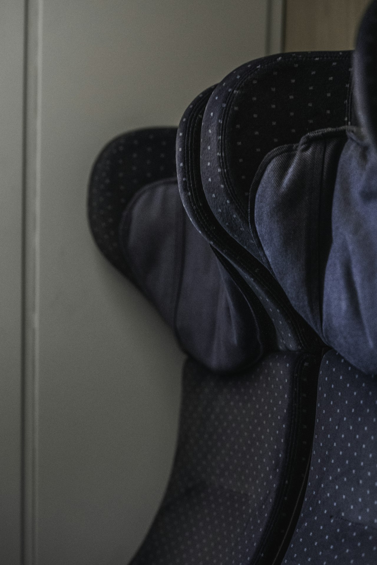 Traveller&rsquo;s shoes propped on an airport seat, feet up between flights